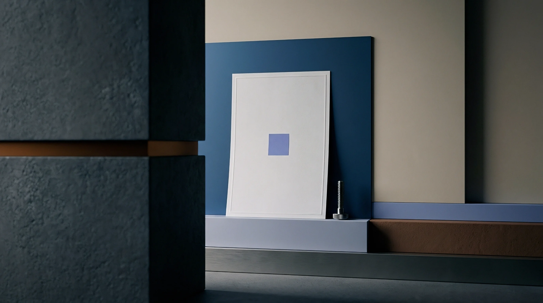 A minimalist studio composition displays a white framed board with a central purple square, presented on stacked plinths amidst varied material blocks.